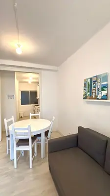 a kitchen with white cabinets and a microwave and a sink at Sagrada Familia - Sant Pau apartment in Barcelona