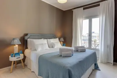 a bedroom with a bed and a large window at Sweett - The Roca House in Barcelona