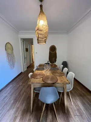 a dining room with a wooden table and chairs at Big and Bright Apartment BCN in Barcelona