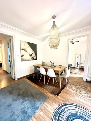 a dining room with a wooden table and chairs at Big and Bright Apartment BCN in Barcelona