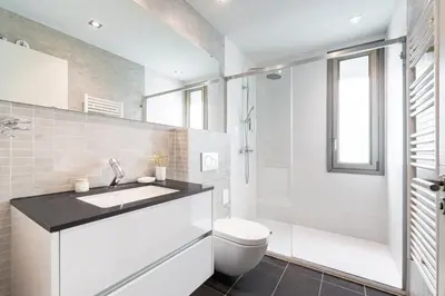 a bathroom with a sink and a toilet and a shower at Aspasios Paseo de Gracia Apartments in Barcelona