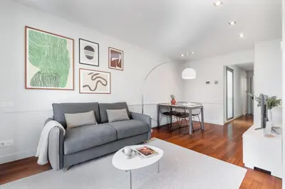 a living room with a couch and a table at Aspasios Paseo de Gracia Apartments in Barcelona