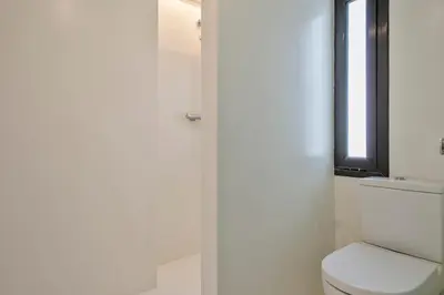 a bathroom with a toilet and a window at My Address in Plaza Real in Barcelona