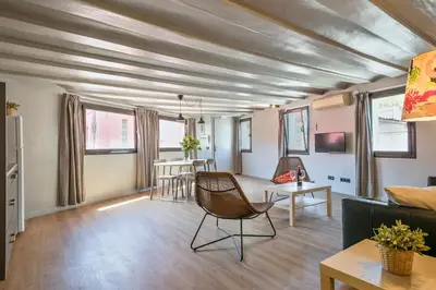 a living room with a couch and a table at My Address in Plaza Real in Barcelona