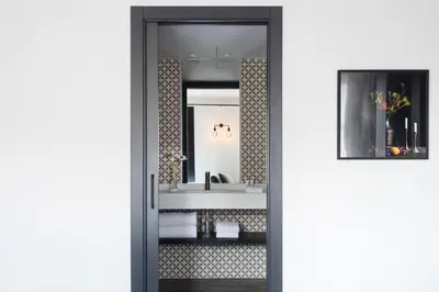 a bathroom with a sink and a mirror at Yurbban Ramblas Boutique Hotel in Barcelona