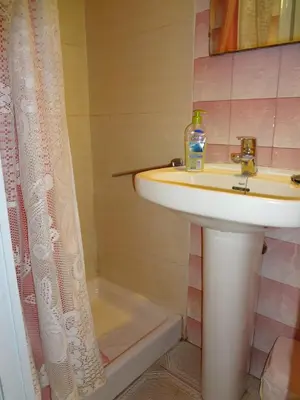 a bathroom with a sink and a shower at Hostal Sant Carlo in Barcelona