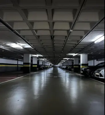 an empty parking garage with cars parked in it at Apartamento Noemi in Barcelona