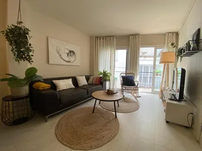 a living room with a couch and a table at Casa Susana in Sitges