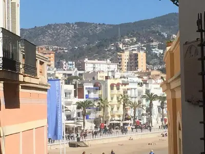 a view of a city with a beach and buildings at Casa Susana in Sitges
