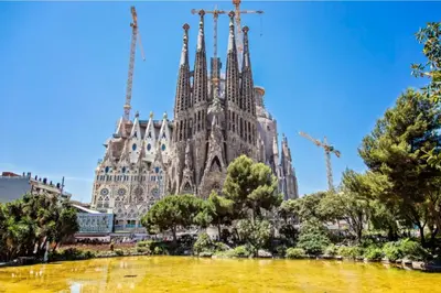 a cathedral with a pond in front of it at Sweett - Monumental in Barcelona