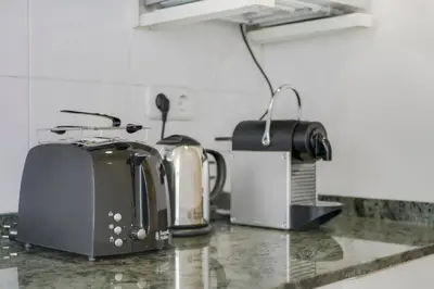 a kitchen counter with two toasters and a toaster at Sweett - Monumental in Barcelona