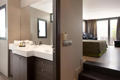 a bathroom with a sink and a mirror at Dalia Ramblas in Barcelona