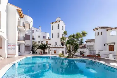 a swimming pool in front of a building at Sitges Casa del Mar - Impresionantes vistas al mar in Sitges