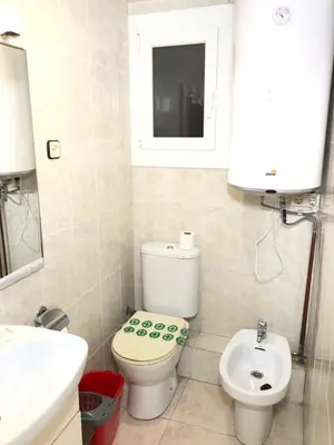 a bathroom with a toilet and a sink at New! Apartment for 3 people near Fira Gran Via in Hospitalet de Llobregat