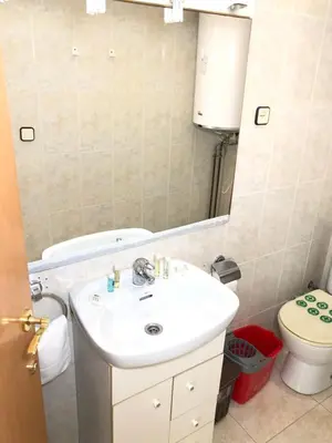 a bathroom with a sink and a toilet and a mirror at New! Apartment for 3 people near Fira Gran Via in Hospitalet de Llobregat