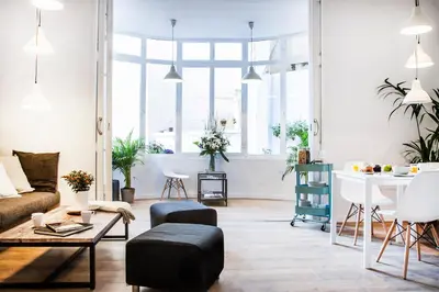 a living room with a couch and a table at Cien in Barcelona
