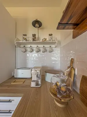 a kitchen with a counter top with a counter top at Villa Mar & Natura Sitges in Canyelles