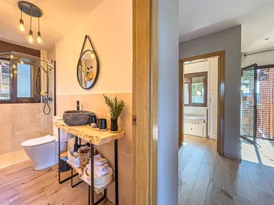 a bathroom with a sink and a toilet at Villa Mar & Natura Sitges in Canyelles