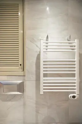 a bathroom with a white towel rack on the wall at SUN RAMBLA CATALUNYA GAUDI (Limpieza Desinfección) in Barcelona