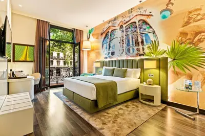 a hotel room with a bed and a window at Hotel Indigo Barcelona - Plaza Catalunya 4Sup by IHG in Barcelona