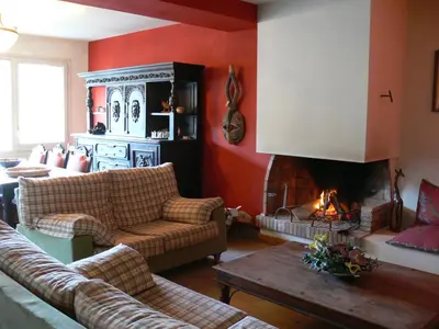 a living room with a couch and a fireplace at Can Seuba in Rellinars