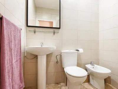 a bathroom with a toilet and a sink at Sant Antoni Market in Barcelona