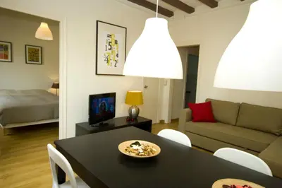 a living room with a table and a couch at Sant Antoni Market in Barcelona