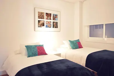 two beds sitting next to each other in a room at CIUDADELA PARK 1 in Barcelona