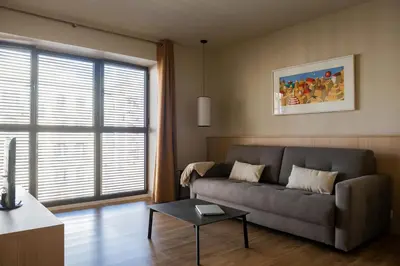 a living room with a couch and a table at MH Apartments Urban in Barcelona