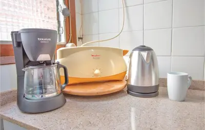a kitchen counter with a blender and a toaster at Stunning Apartment In Pineda De Mar in Pineda de Mar