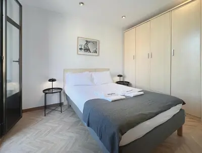 a bedroom with a large bed in a room at Stay U-nique Apartments Calabria in Barcelona