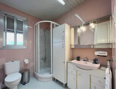 a bathroom with a toilet and a sink and a shower at Stay U-nique Apartments Calabria in Barcelona