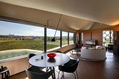 a living room with a table and chairs and a couch at Mastinell Cava & Boutique Hotel by Olivia Hotels Collection in Vilafranca del Penedès