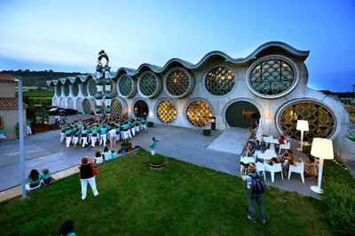a group of people sitting in chairs in front of a building at Mastinell Cava & Boutique Hotel by Olivia Hotels Collection in Vilafranca del Penedès