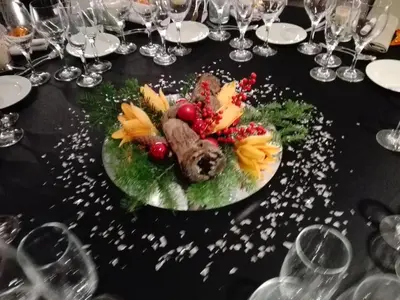 a black table with a plate of food on it at Mastinell Cava & Boutique Hotel by Olivia Hotels Collection in Vilafranca del Penedès