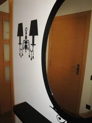 a mirror and a door in a room at Pierre & Vacances Barcelona Sants in Barcelona