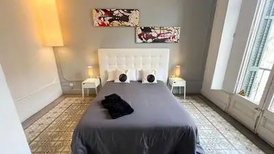 a bedroom with a bed with two pillows on it at Des Artistes in Barcelona