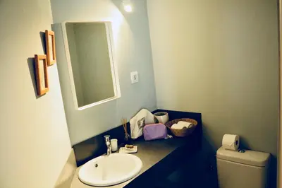 a bathroom with a sink and a toilet and a mirror at La Casa Gran B&B in Barcelona