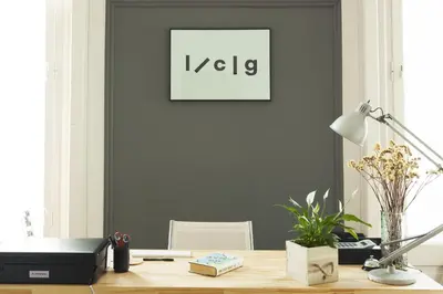 an office with a desk with a picture on the wall at La Casa Gran B&B in Barcelona
