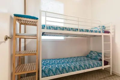 a couple of bunk beds in a room at Gopal - Piso 7 pax con wifi y calefacción Gracia Barcelona in Barcelona