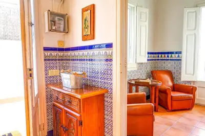 a kitchen with blue and white tile on the wall at The Beach House Paradise by Hello Homes Sitges in Sitges