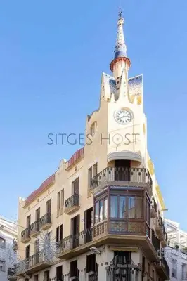 a building with a clock tower on top of it at Sitges CENTRAL - En el corazón de Sitges in Sitges