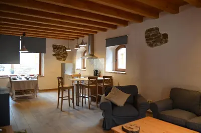 a living room with a couch and a table at Cal Puó Turismo Rural in Collsuspina