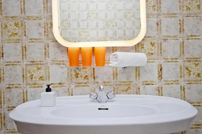 a bathroom with a white sink and a mirror at Barcelona City Seven Hostal in Barcelona