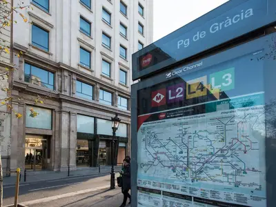 a sign in front of a building with a map at Fewdays Barcelona Apartments in Barcelona