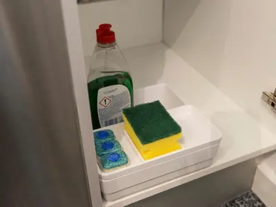 a bottle of detergent and a container of soap in a refrigerator at Fewdays Barcelona Apartments in Barcelona