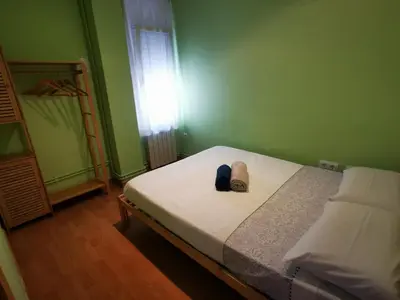 a small bedroom with a bed and a window at Elsi's place in Premiá de Mar