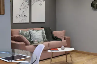 a living room with a couch and a table at Sagrada Familia Xamfrà in Barcelona