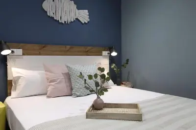 a bedroom with a bed with a vase on it at Sagrada Familia Xamfrà in Barcelona