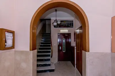 an archway leading to a staircase in a building at HomeHolidaysRentals Etoile in Calella